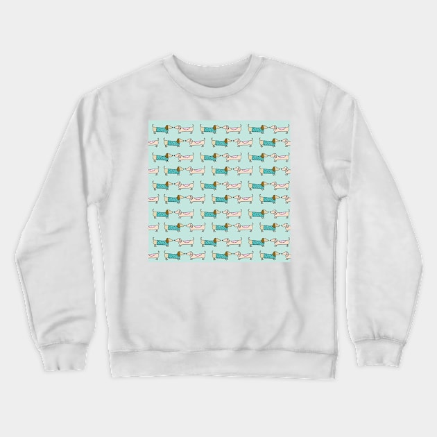 Cute dachshunds in light blue background Crewneck Sweatshirt by bigmoments